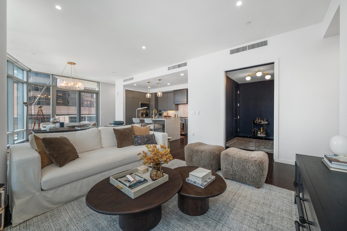 200 Congress Avenue, Unit 19F Austin, TX 78701 - Photo 16 of 40 a living room with furniture and a view of kitchen