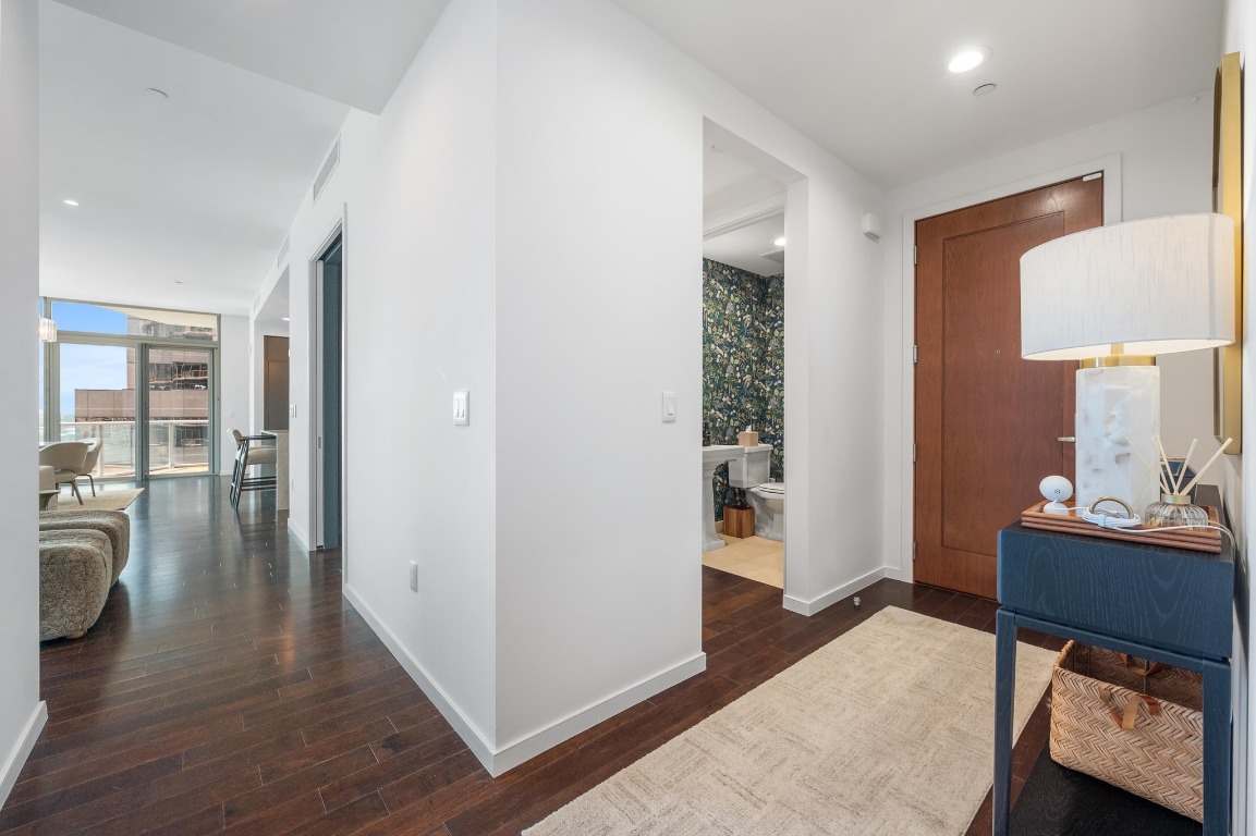 200 Congress Avenue, Unit 19F Austin, TX 78701 - Photo 26 of 40 a room with furniture and wooden floor