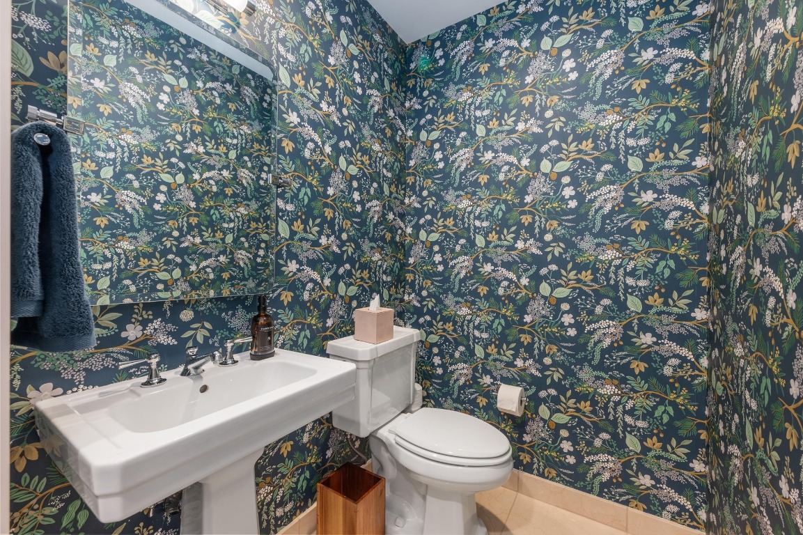 200 Congress Avenue, Unit 19F Austin, TX 78701 - Photo 27 of 40 a white toilet sitting next to a bathroom sink