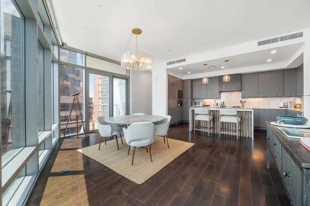 a kitchen with a table and chairs in it