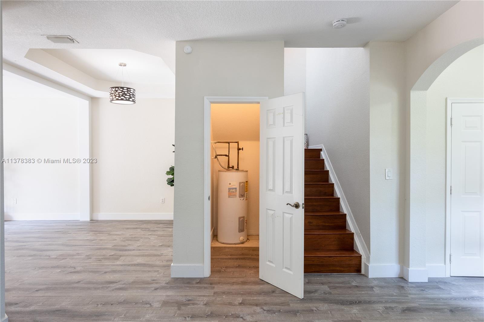 Vizcaya Miramar, FL 33027 - Photo 15 of 35 a view of a hallway with entryway wooden floor and front door