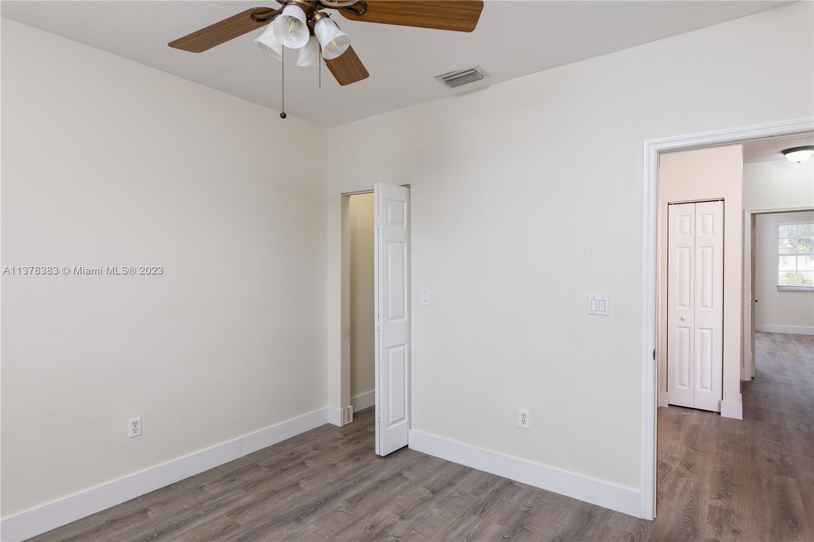 Vizcaya Miramar, FL 33027 - Photo 20 of 35 an empty room with wooden floor and ceiling fan