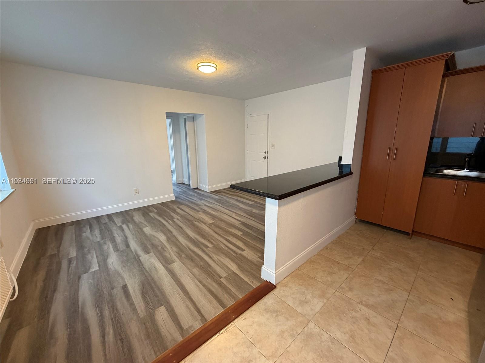 7928 Harding Avenue, Unit 1 Miami Beach, FL 33141 - Photo 5 of 12 a view of an empty room