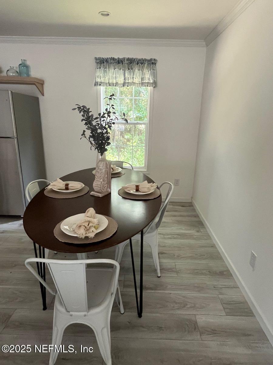 540324 Lem Turner Road Callahan, FL 32011 - Photo 11 of 25 a view of a dining room with furniture and wooden floor