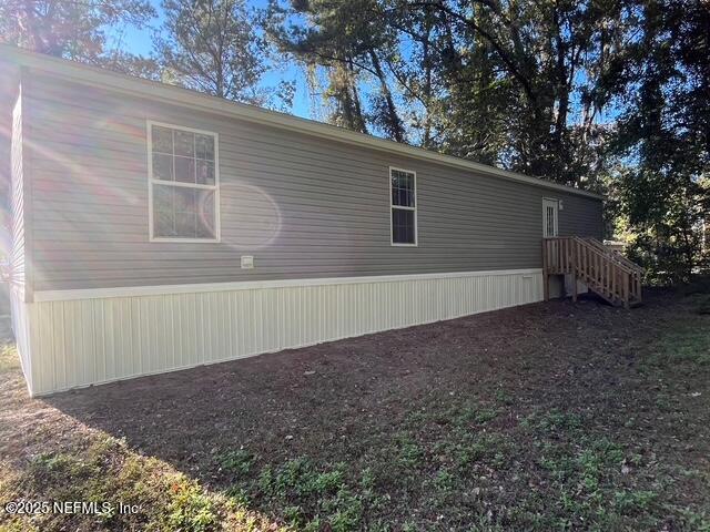 540324 Lem Turner Road Callahan, FL 32011 - Photo 24 of 25 a view of a backyard with a large tree