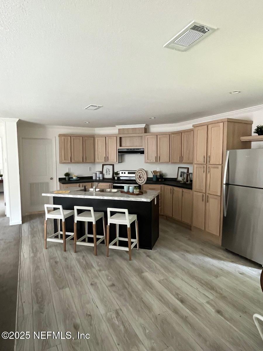 540324 Lem Turner Road Callahan, FL 32011 - Photo 5 of 25 a kitchen with stainless steel appliances a refrigerator and a stove top oven