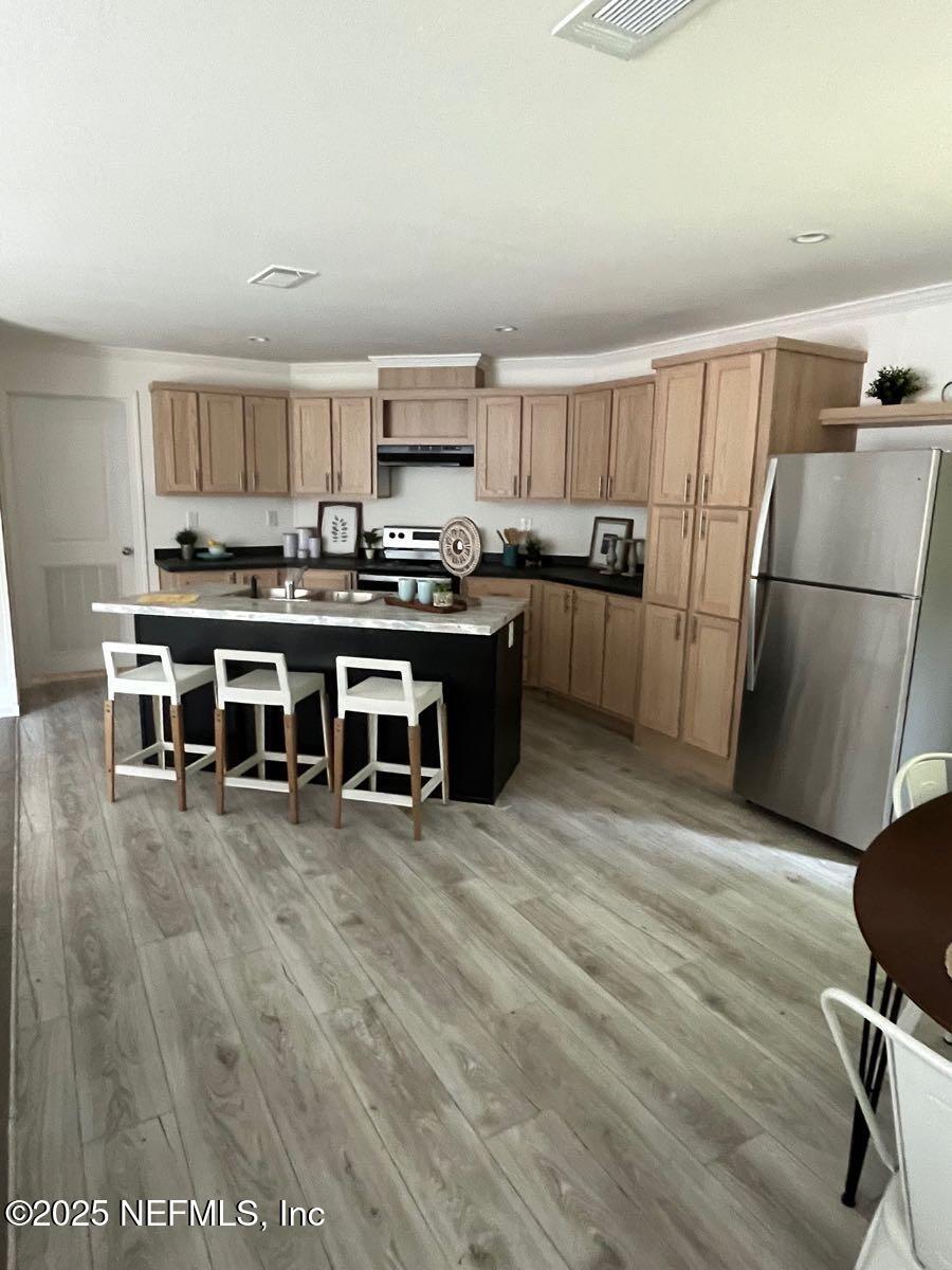 540324 Lem Turner Road Callahan, FL 32011 - Photo 7 of 25 a view of a kitchen with stainless steel appliances granite countertop a stove top oven a sink and a refrigerator