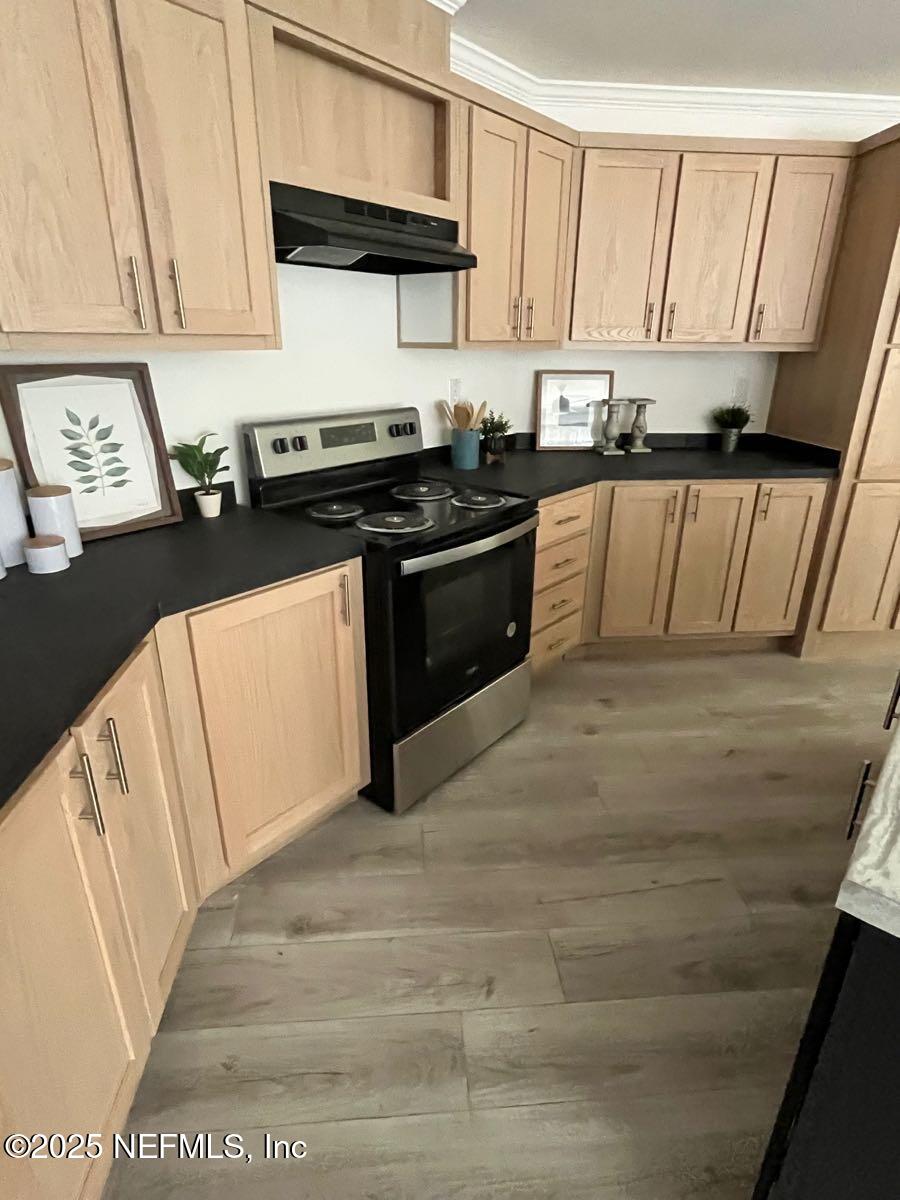540324 Lem Turner Road Callahan, FL 32011 - Photo 8 of 25 a kitchen with granite countertop a sink a stove and cabinets