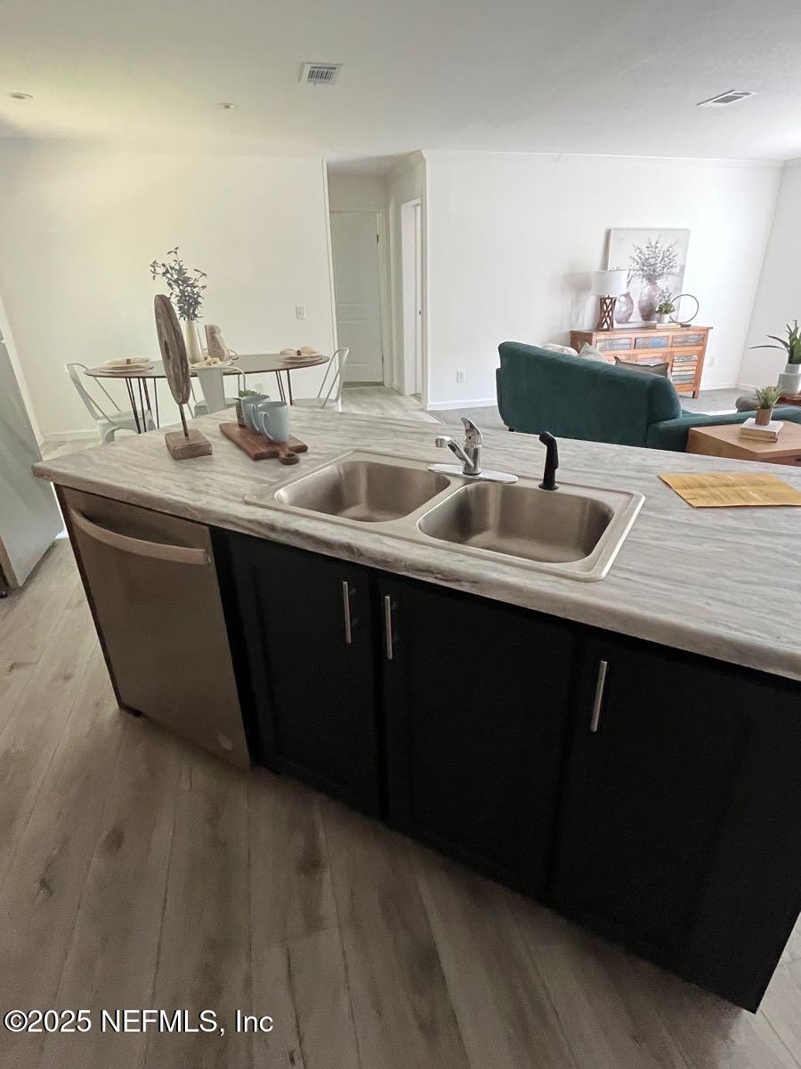 540324 Lem Turner Road Callahan, FL 32011 - Photo 9 of 25 a kitchen with a sink and cabinets