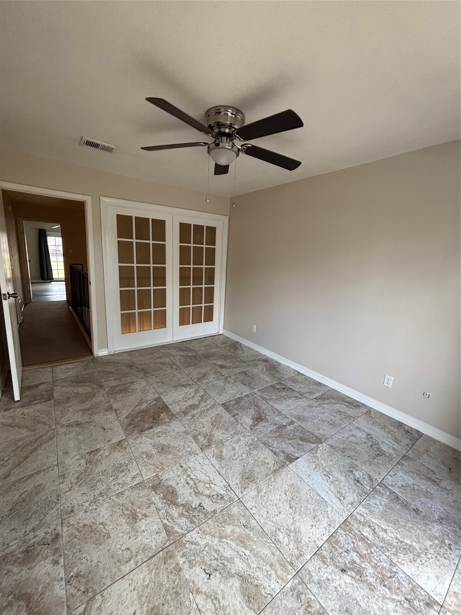 14515 Wunderlich Drive, Unit 315 Houston, TX 77069 - Photo 24 of 37 Primary Bedroom with French Privacy Panels & Ceiling Fan
