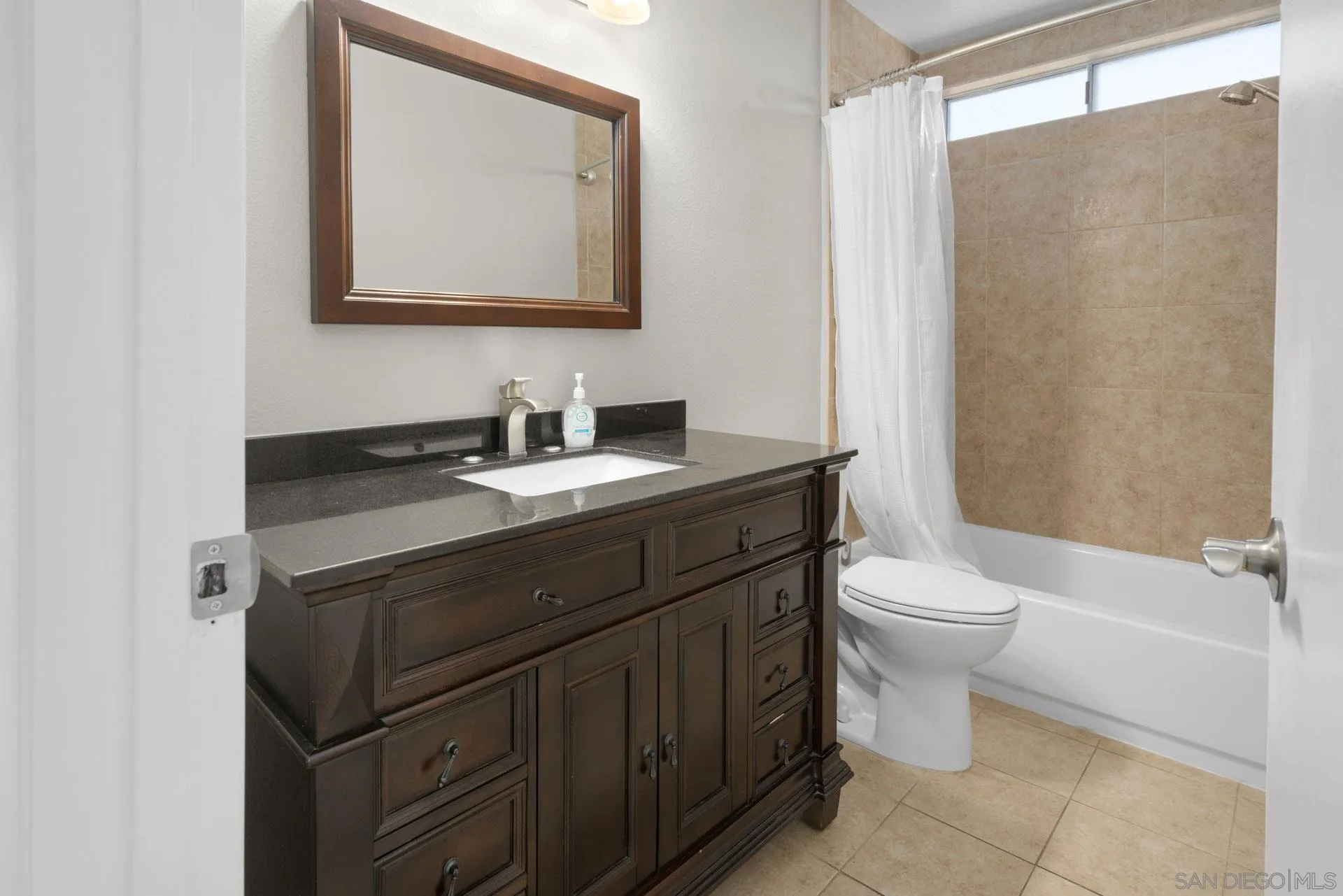 913 Buena Rosa Court Fallbrook, CA 92028 - Photo 19 of 45 a bathroom with a sink a toilet and shower