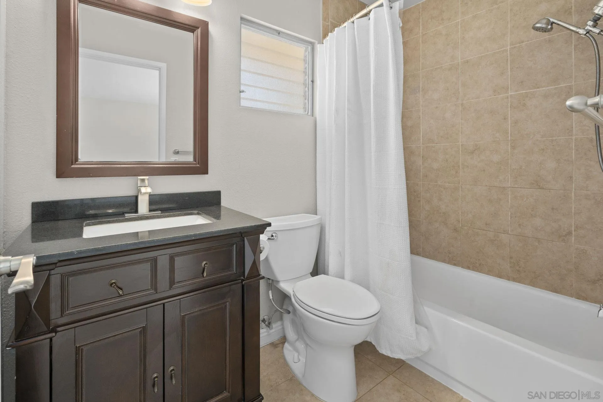913 Buena Rosa Court Fallbrook, CA 92028 - Photo 22 of 45 a bathroom with a sink a toilet and shower