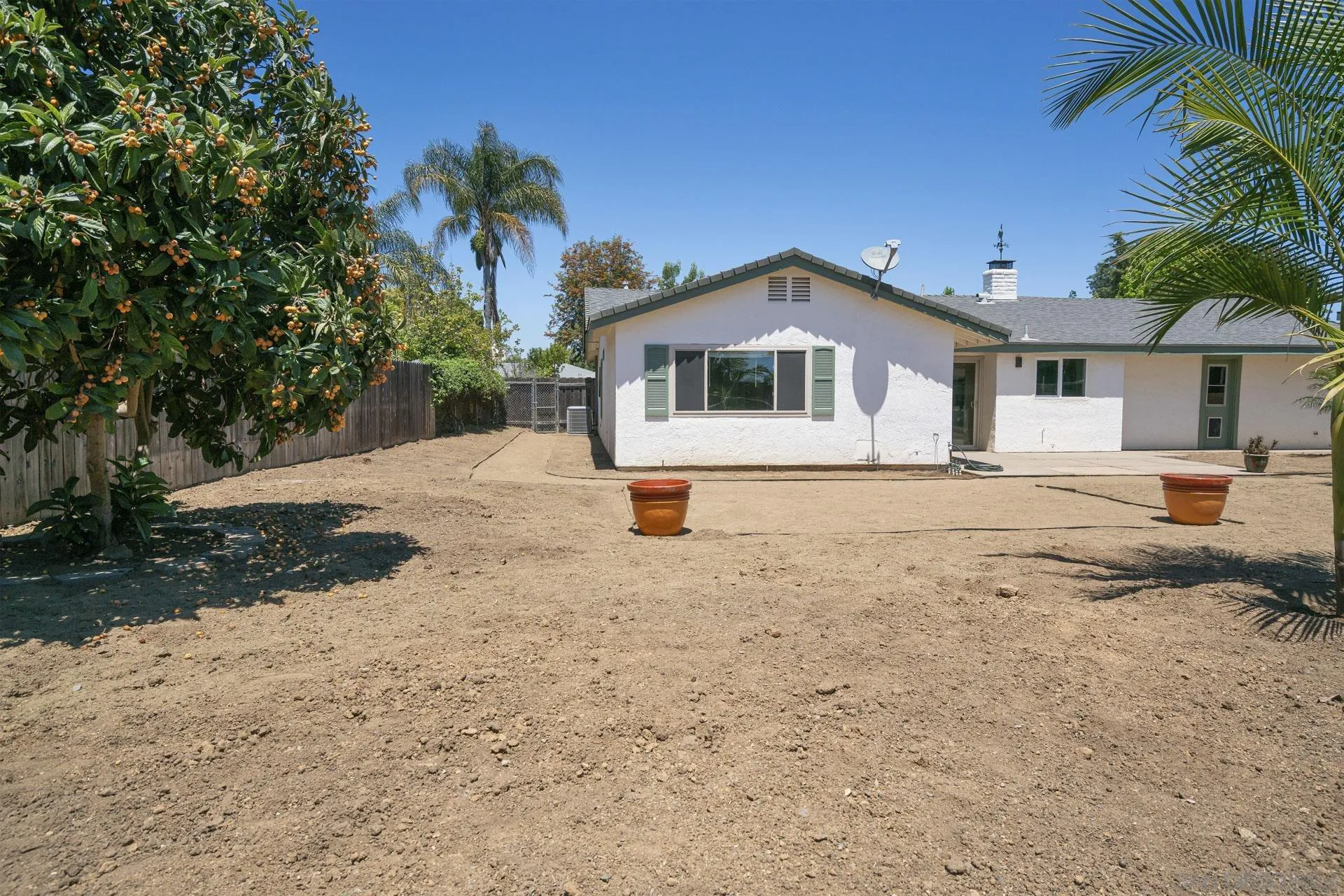 913 Buena Rosa Court Fallbrook, CA 92028 - Photo 34 of 45 a front view of a house with a yard and garage