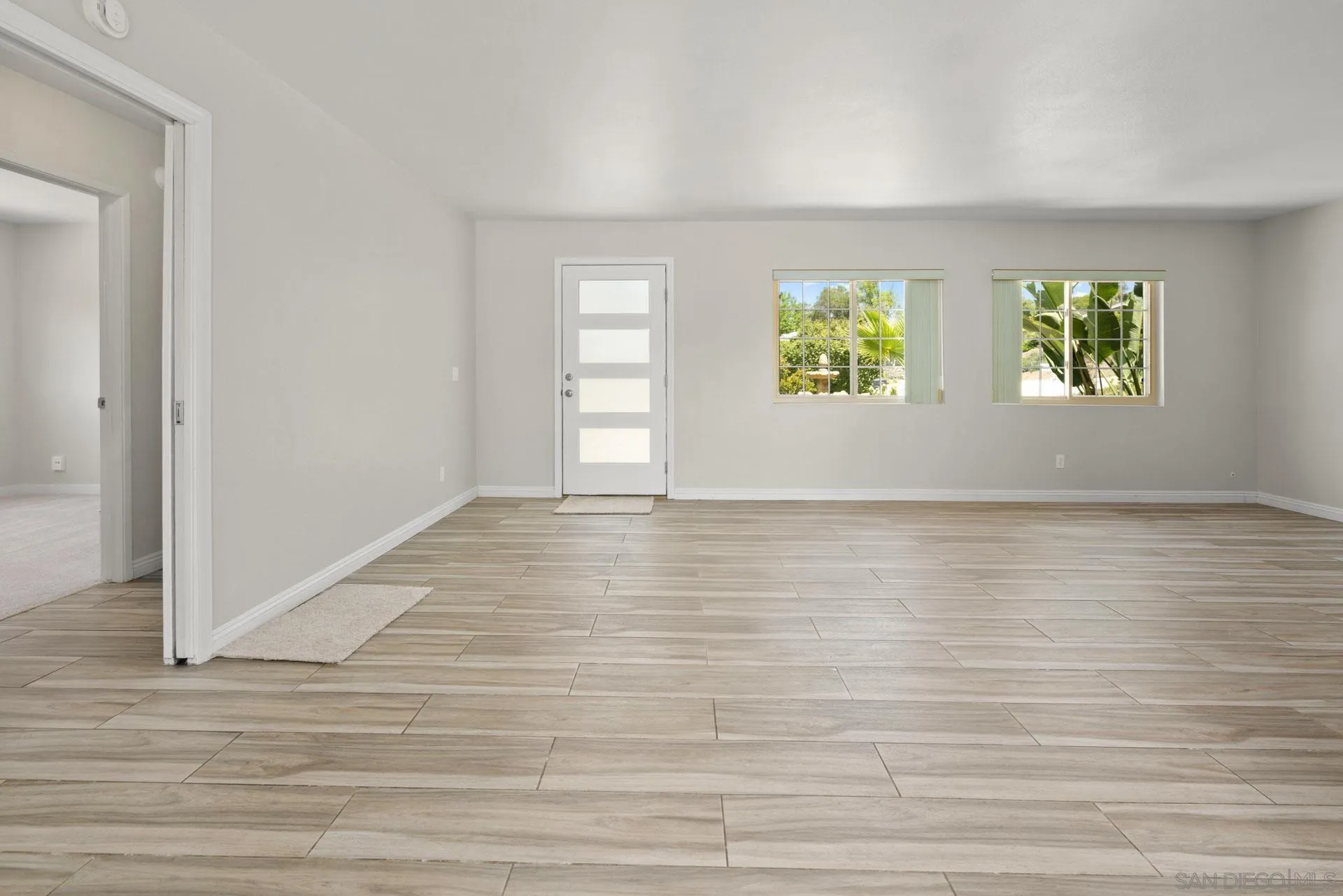 913 Buena Rosa Court Fallbrook, CA 92028 - Photo 8 of 45 a view of room with window and wooden floor