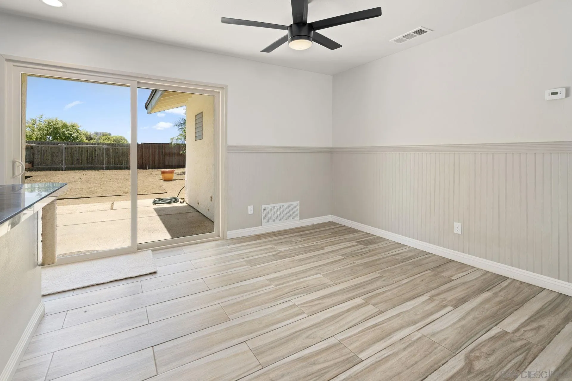 913 Buena Rosa Court Fallbrook, CA 92028 - Photo 9 of 45 a view of a room with wooden floor and iron stairs