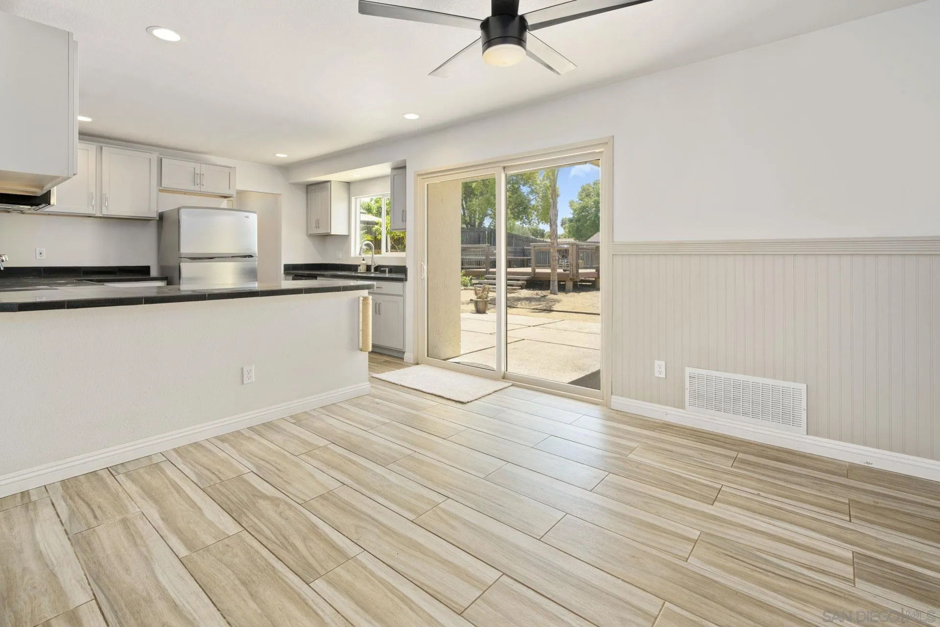 913 Buena Rosa Court Fallbrook, CA 92028 - Photo 10 of 45 a view of a kitchen with wooden floor and electronic appliances