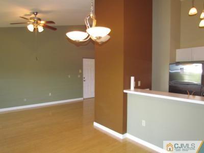 737 Edpas Road, Unit 737 New Brunswick, NJ 08901 - Photo 3 of 19 a view of a room with a chandelier fan