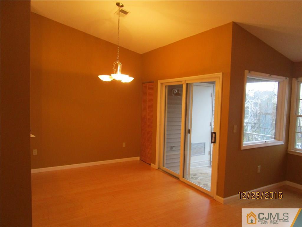 737 Edpas Road, Unit 737 New Brunswick, NJ 08901 - Photo 8 of 19 a view of a livingroom with a window