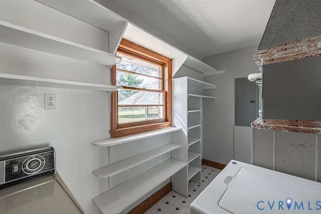 a bathroom with a window and a shower