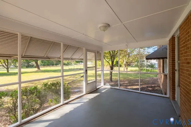 a view of a room with large windows