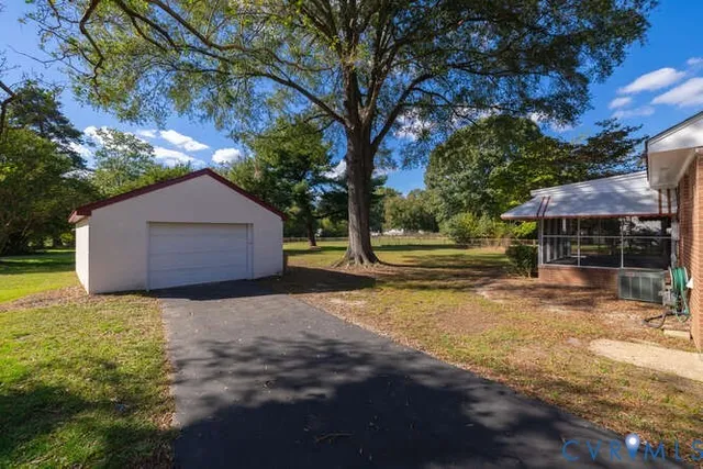 a backyard of a house with lots of green space