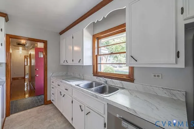 a kitchen with a sink and cabinets