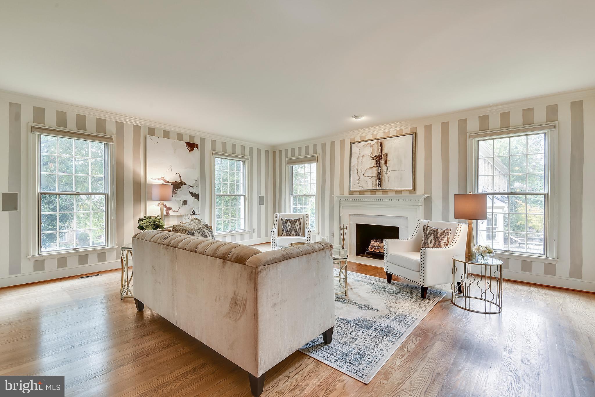 1823 Solitaire Lane McLean, VA 22101 - Photo 11 of 30 Cozy wood fireplace and flowing hardwood floors.