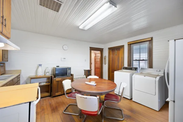 a view of hallway with wooden floor