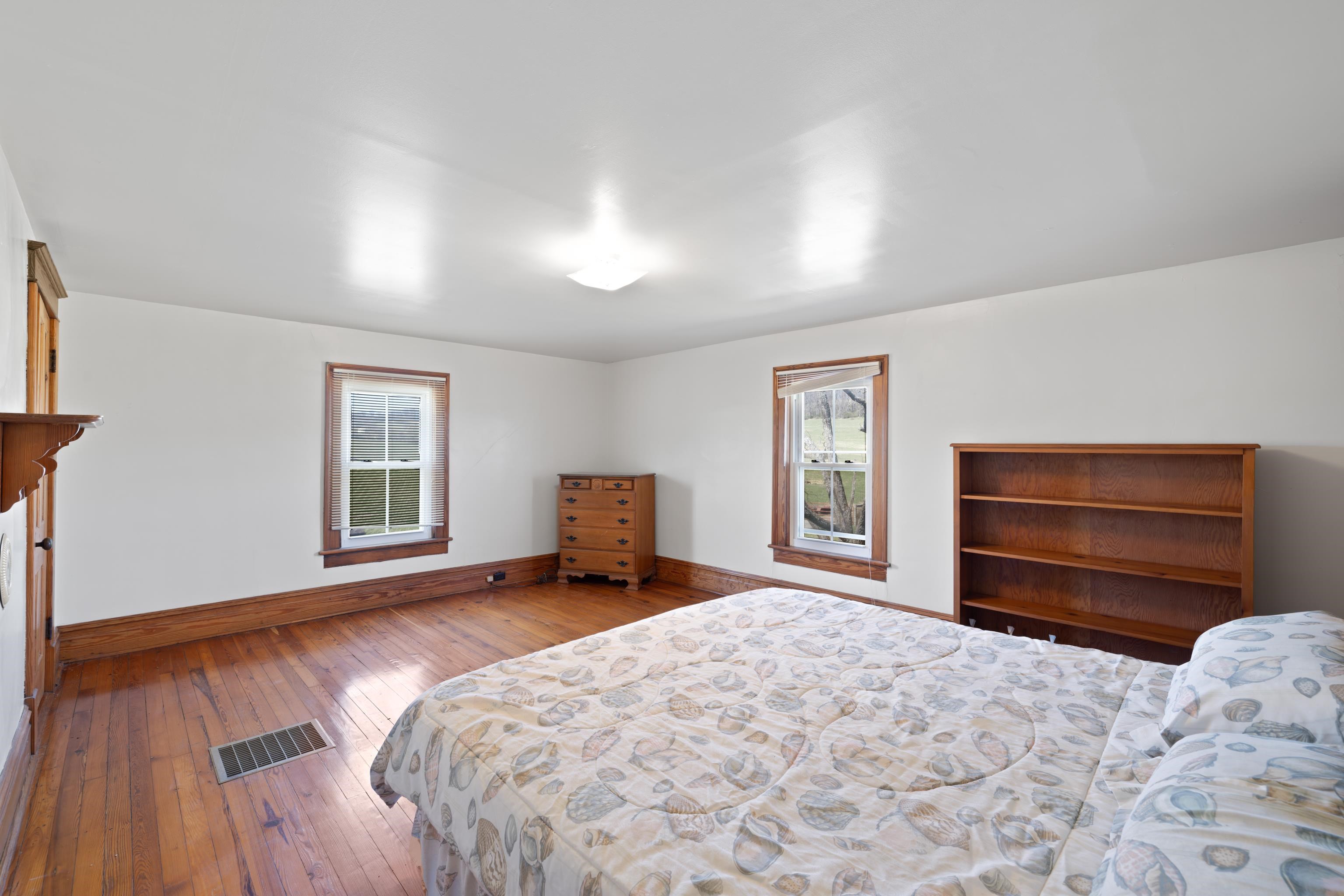 3165 Old Greenville Road Staunton, VA 24401 - Photo 32 of 66 a bed room with a bed and a chair