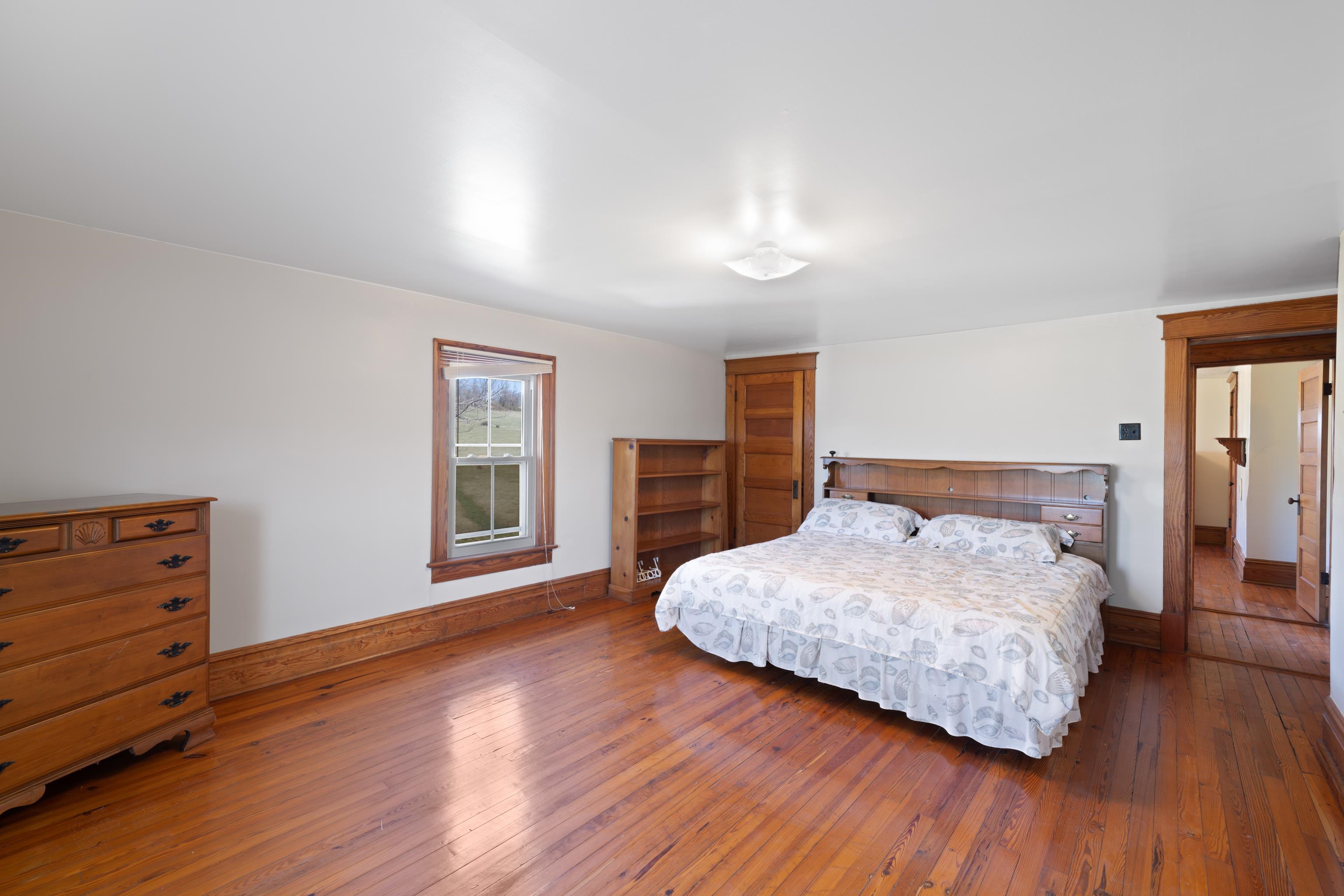 3165 Old Greenville Road Staunton, VA 24401 - Photo 33 of 66 a bedroom with a bed and wooden floor