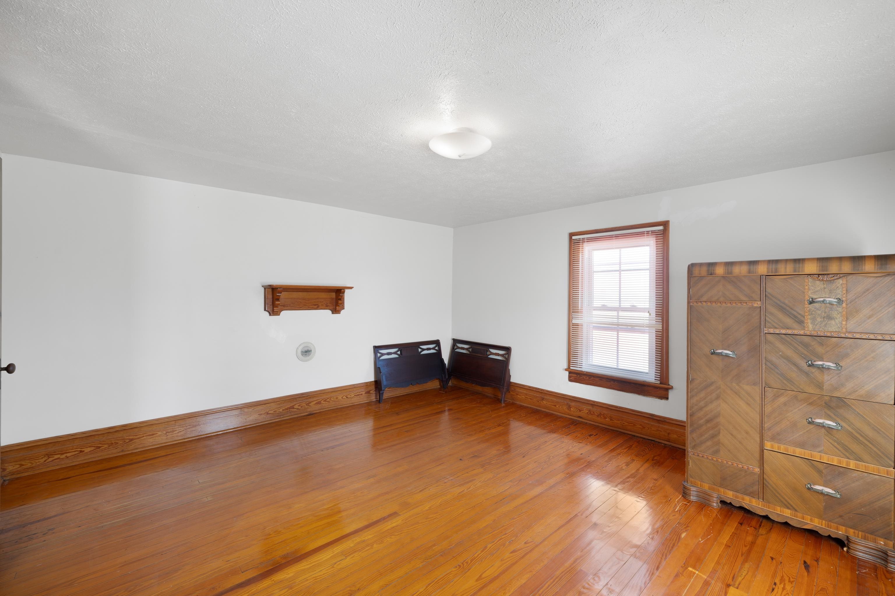 3165 Old Greenville Road Staunton, VA 24401 - Photo 38 of 66 wooden floor in an empty room with a window