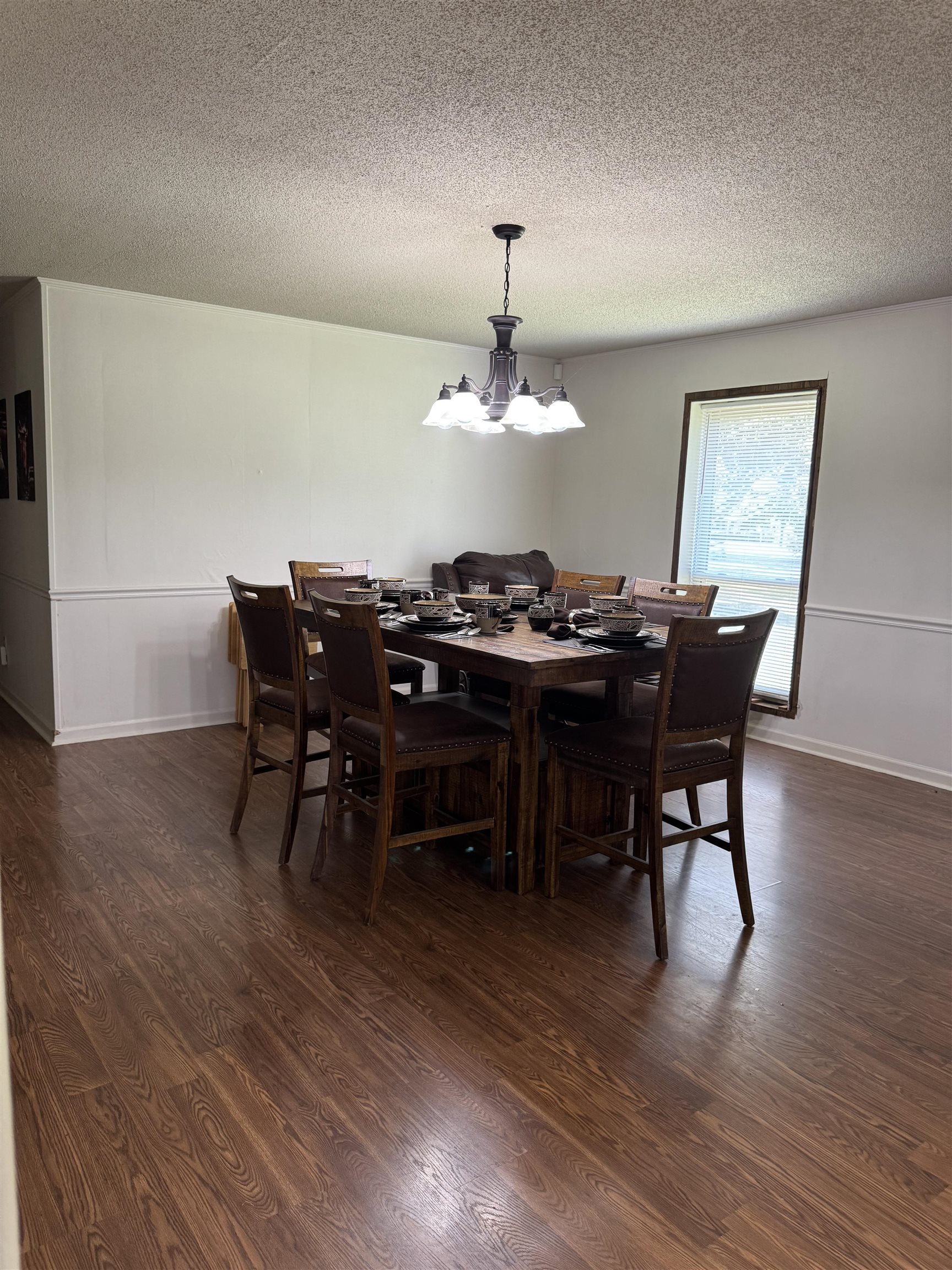2051 Solo Road Covington, TN 38019 - Photo 13 of 31 a view of a dining room with furniture and wooden floor