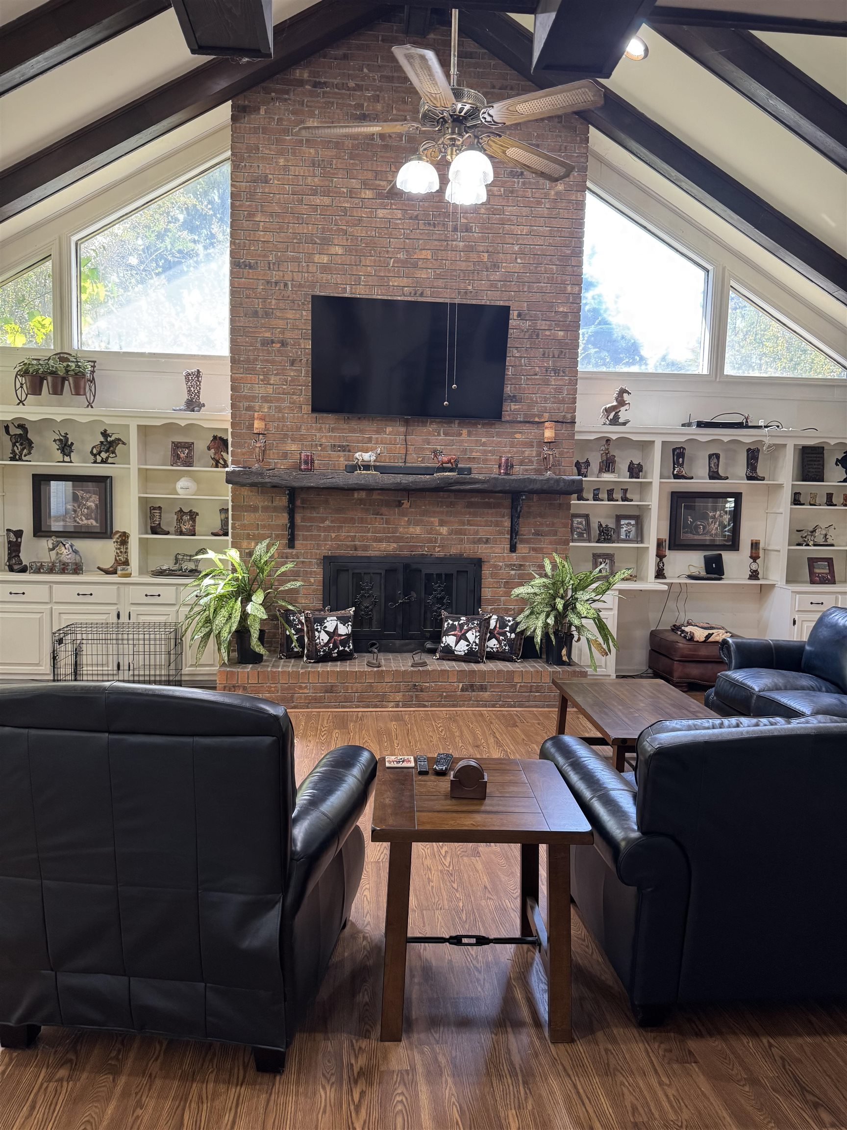2051 Solo Road Covington, TN 38019 - Photo 16 of 31 a living room with furniture a flat screen tv and a fireplace