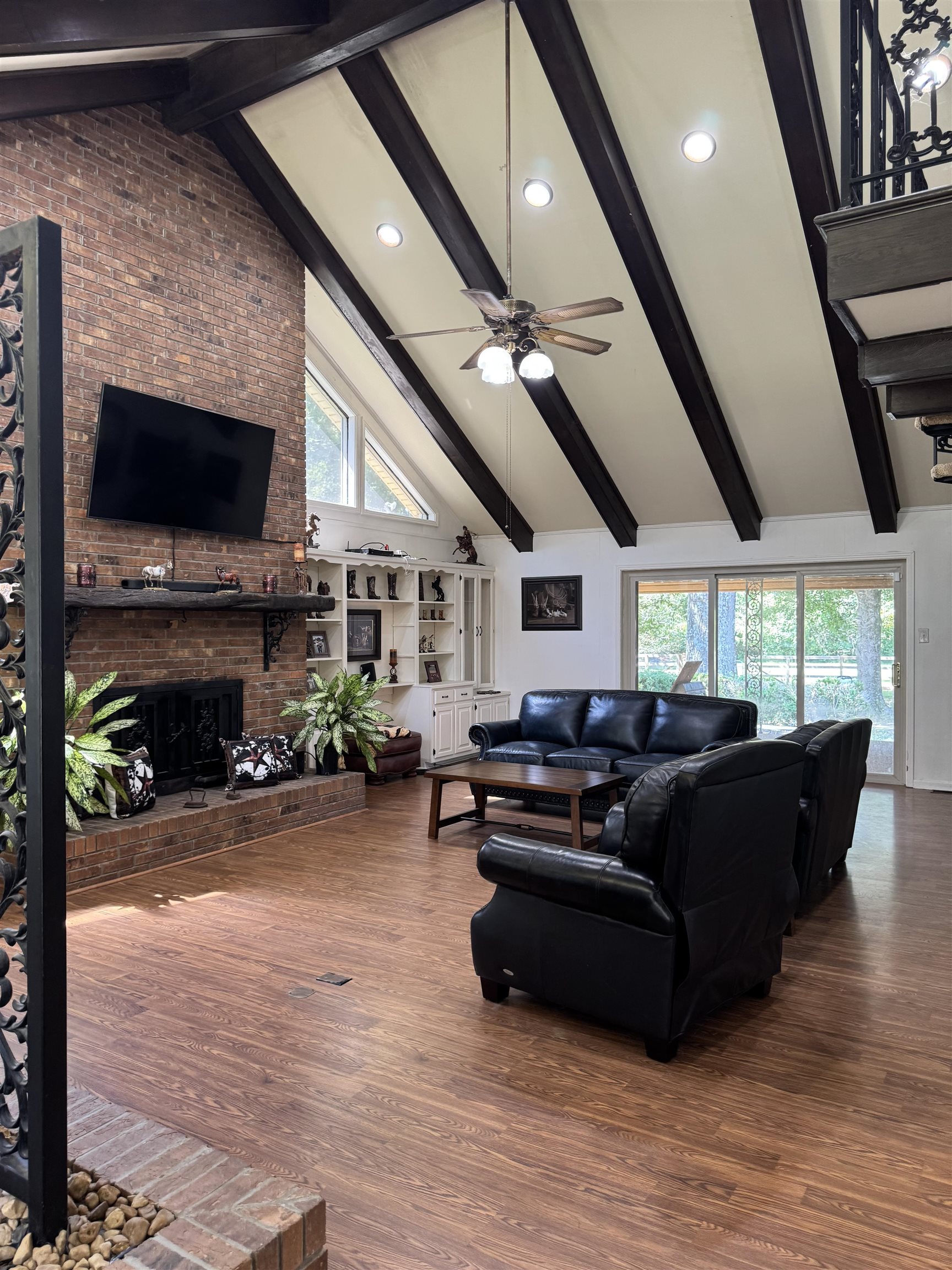2051 Solo Road Covington, TN 38019 - Photo 17 of 31 a living room with furniture a fireplace and a flat screen tv