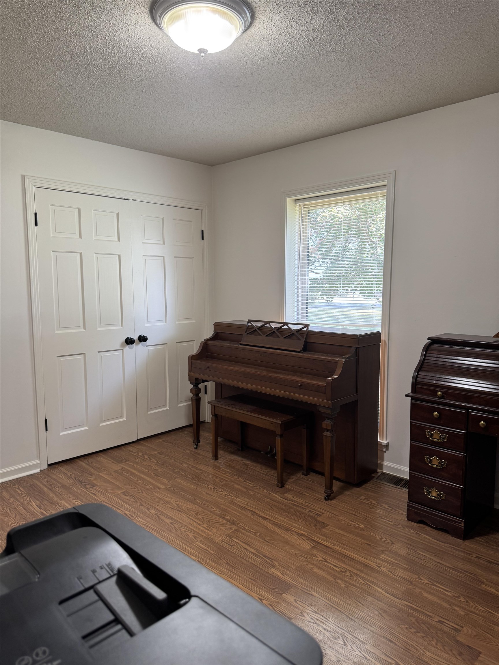 2051 Solo Road Covington, TN 38019 - Photo 21 of 31 a room with a piano and a wooden floor