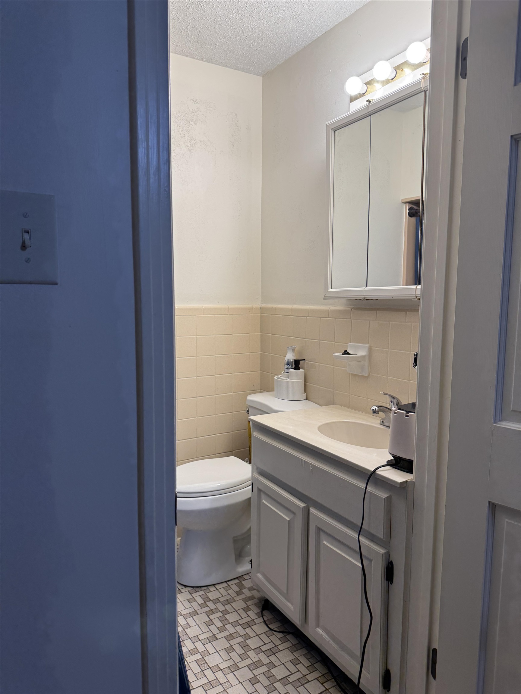 2051 Solo Road Covington, TN 38019 - Photo 24 of 31 a bathroom with a sink a toilet and a mirror