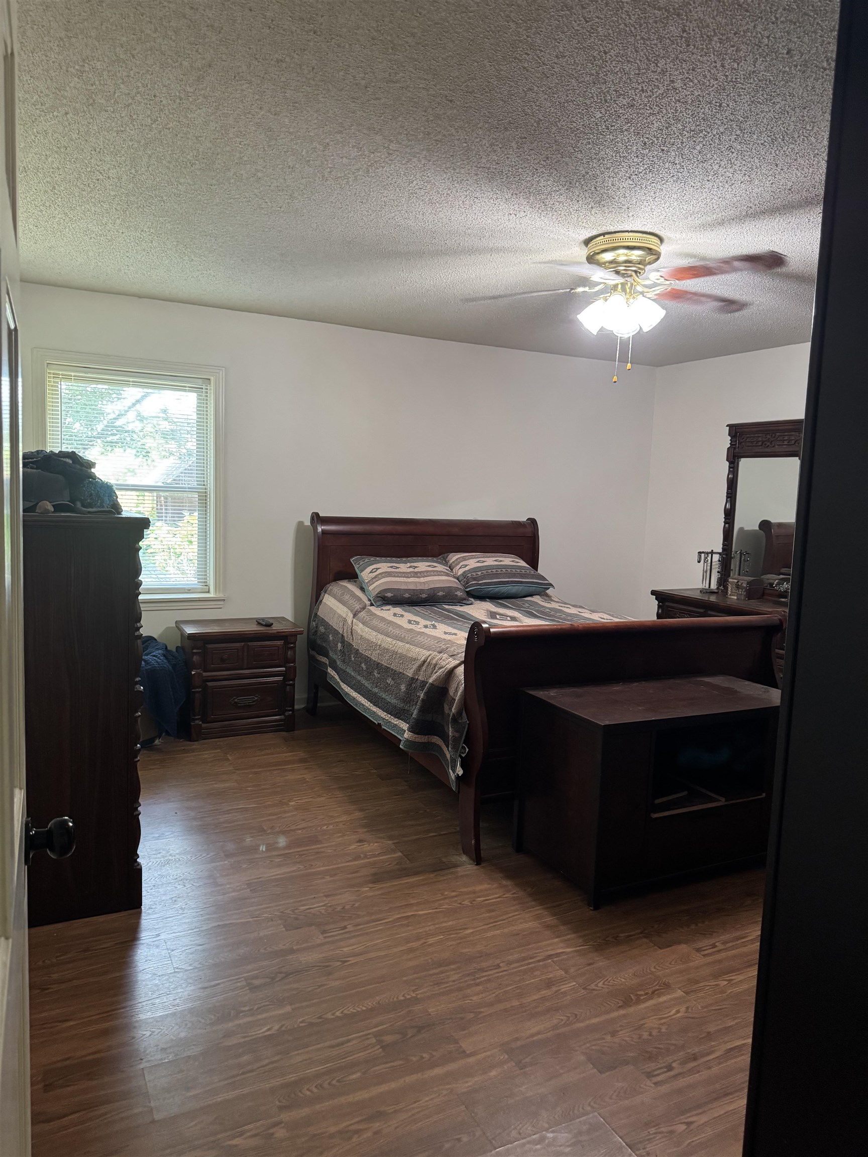 2051 Solo Road Covington, TN 38019 - Photo 25 of 31 a bedroom with a bed and a chandelier