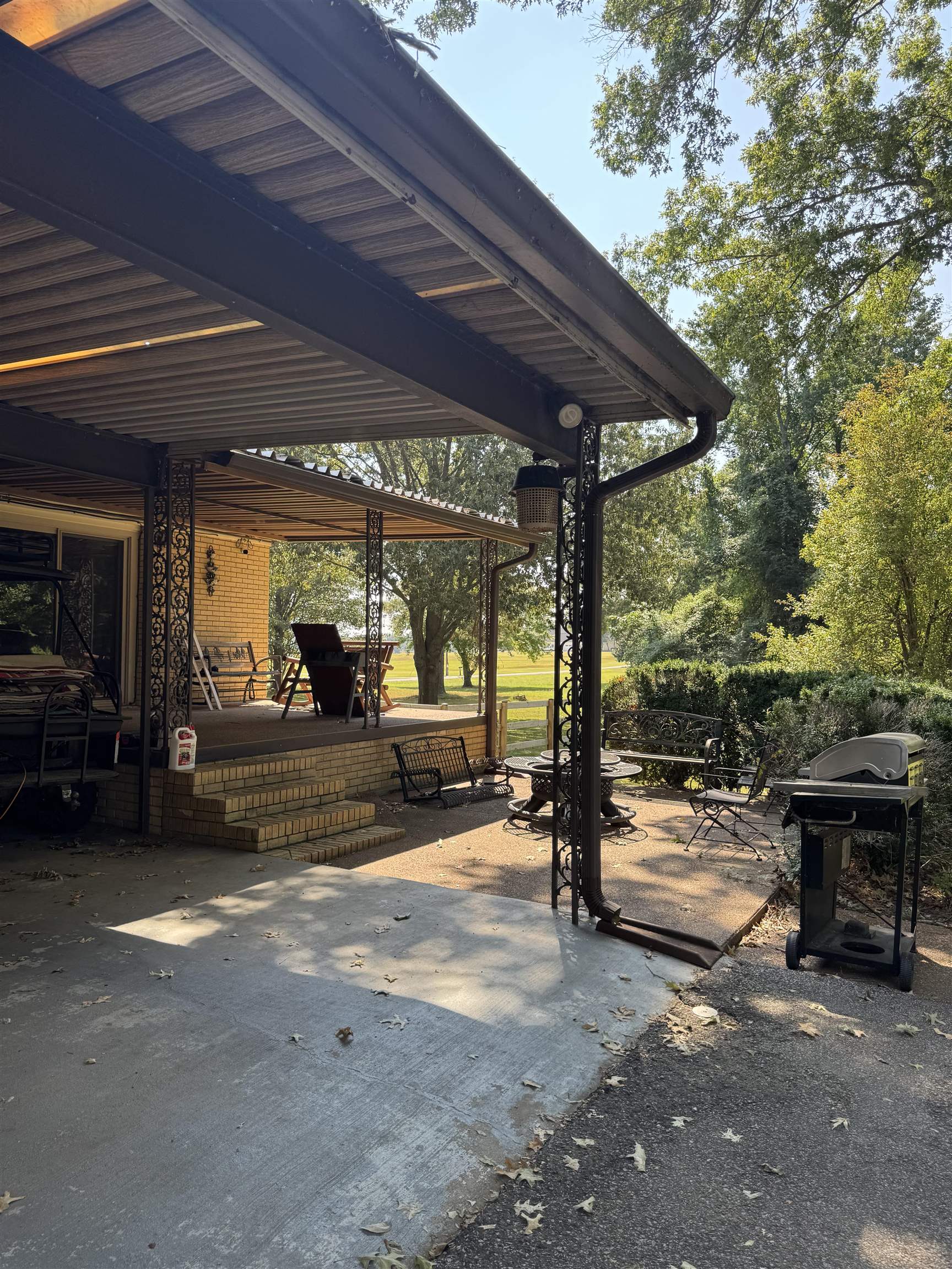 2051 Solo Road Covington, TN 38019 - Photo 26 of 31 a view of a park with table and chairs under an umbrella
