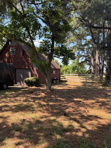 a view of a house with a tree