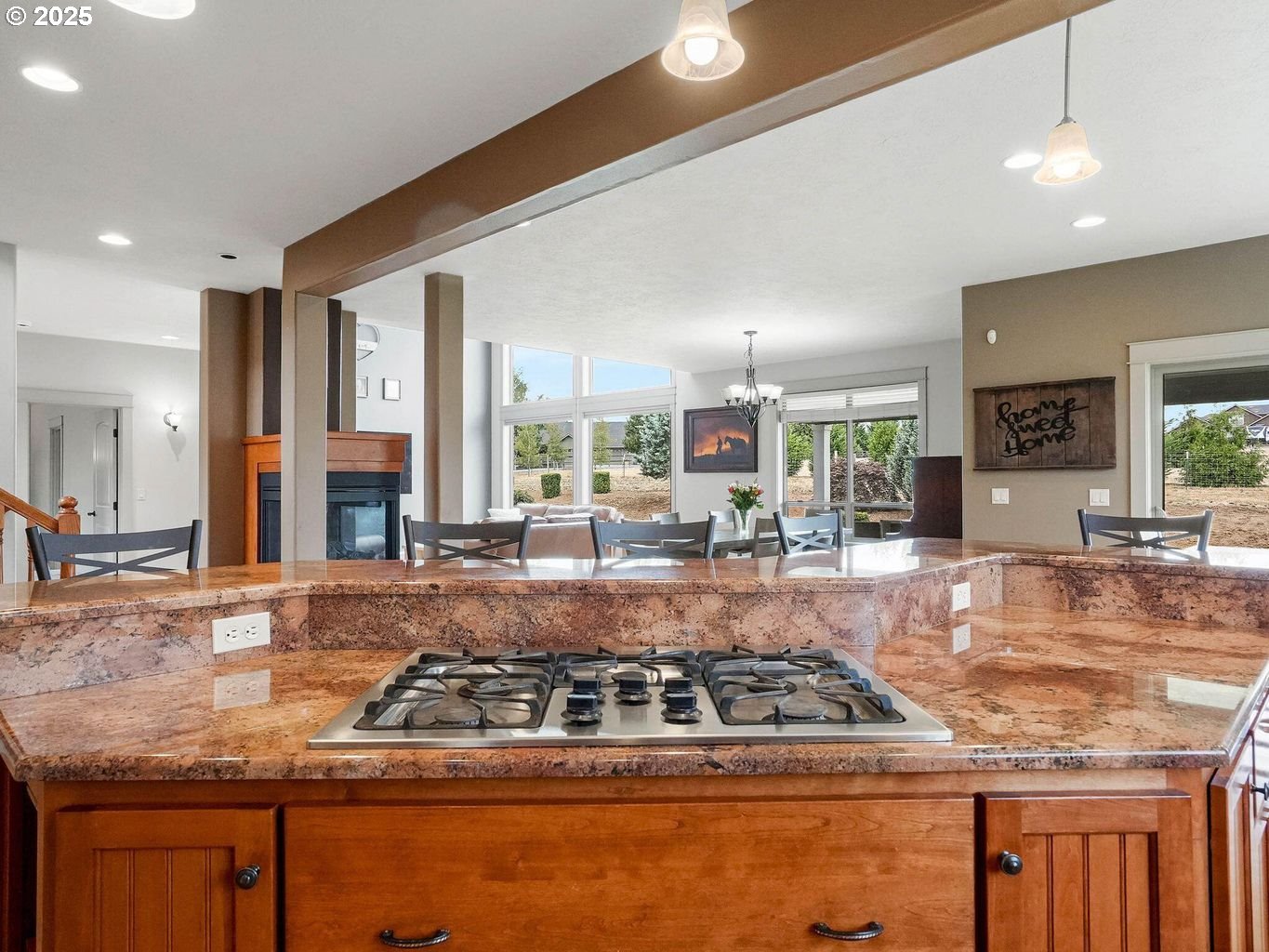 40893 Elk Ridge Lane Stayton, OR 97383 - Photo 11 of 46 a kitchen with kitchen island granite countertop a stove and white cabinets