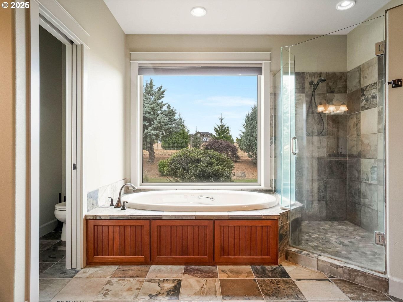 40893 Elk Ridge Lane Stayton, OR 97383 - Photo 19 of 46 a bathroom with a bathtub and a shower