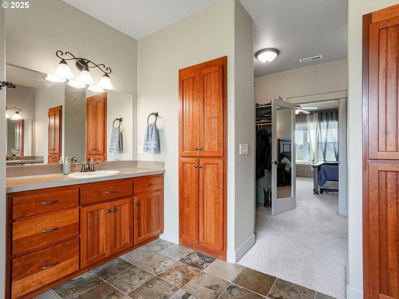 40893 Elk Ridge Lane Stayton, OR 97383 - Photo 21 of 46 a bathroom with a sink a mirror and a shower