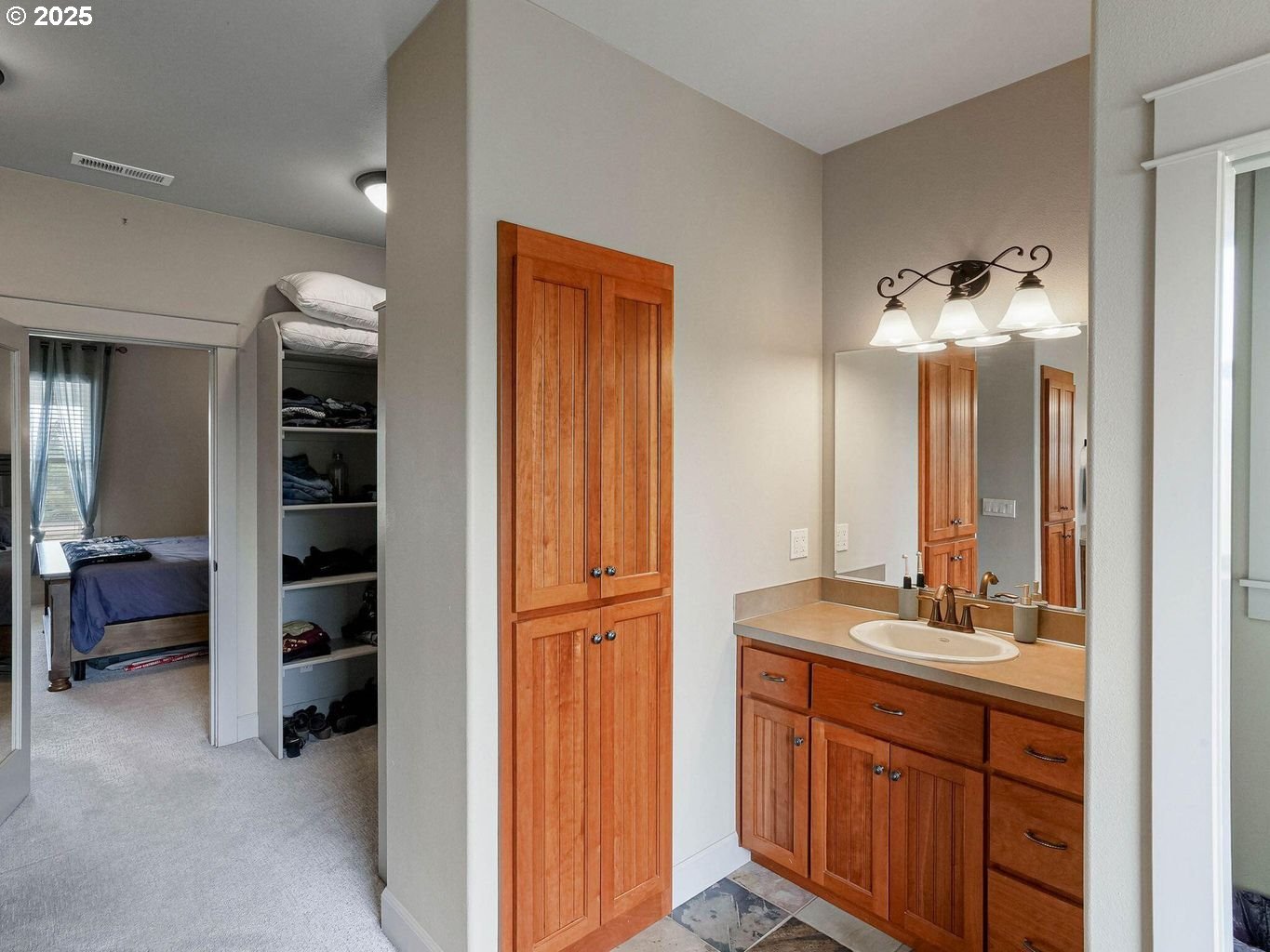 40893 Elk Ridge Lane Stayton, OR 97383 - Photo 22 of 46 a bathroom with a double vanity sink and a mirror