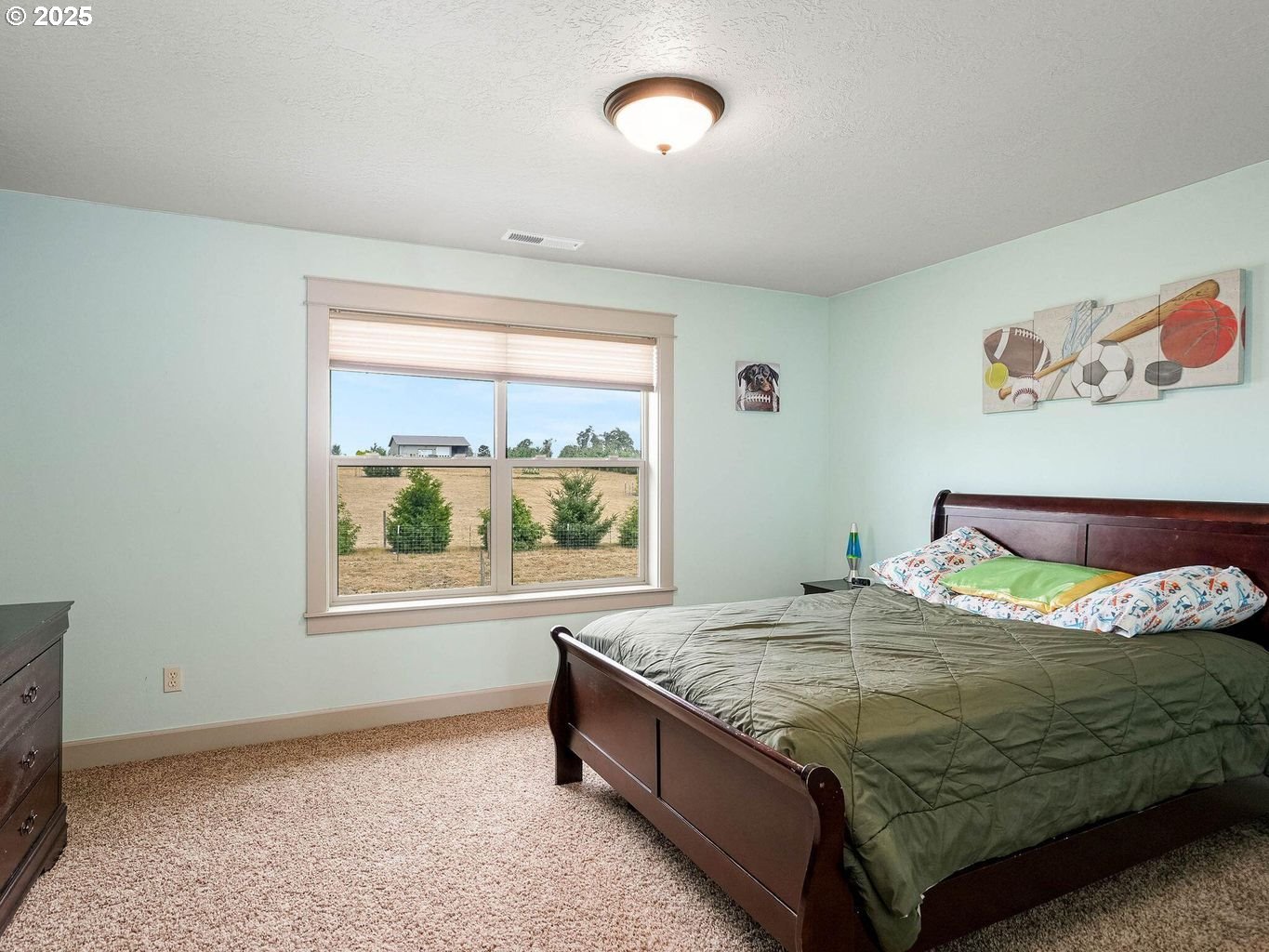 40893 Elk Ridge Lane Stayton, OR 97383 - Photo 28 of 46 a bed sitting in a bedroom next to a window