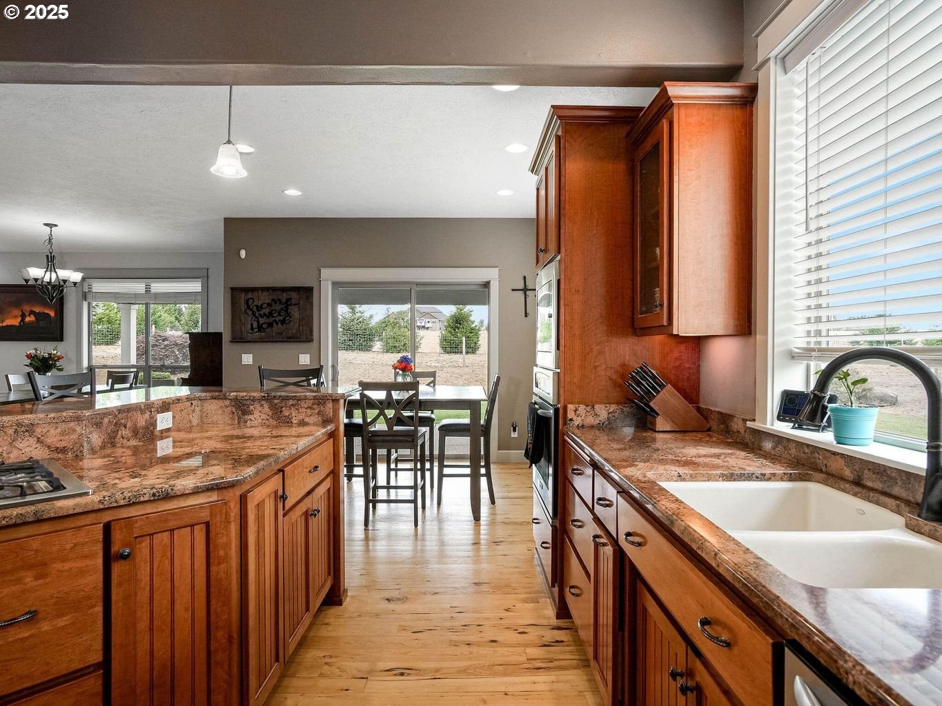 40893 Elk Ridge Lane Stayton, OR 97383 - Photo 10 of 46 a kitchen with stainless steel appliances granite countertop sink stove top oven and cabinets
