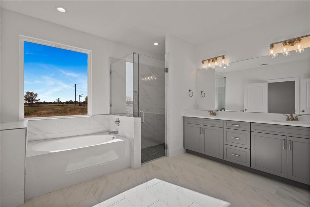 3250 Willow Road Celeste, TX 75423 - Photo 16 of 32 a bathroom with a tub a sink and a large mirror