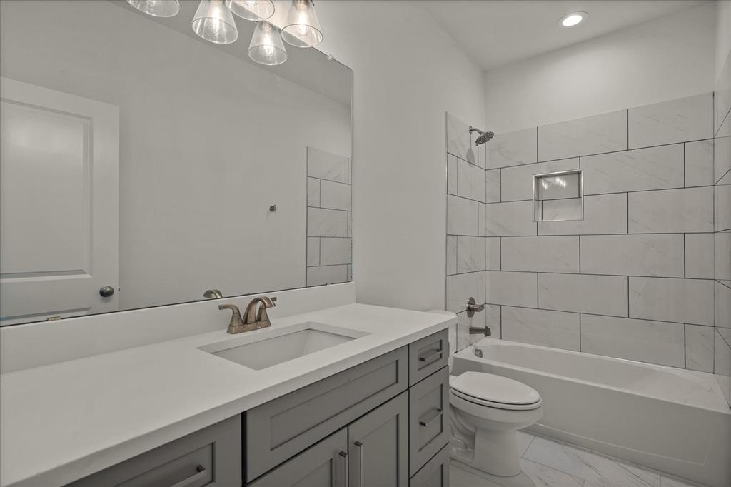 3250 Willow Road Celeste, TX 75423 - Photo 21 of 32 a bathroom with a sink a toilet and shower