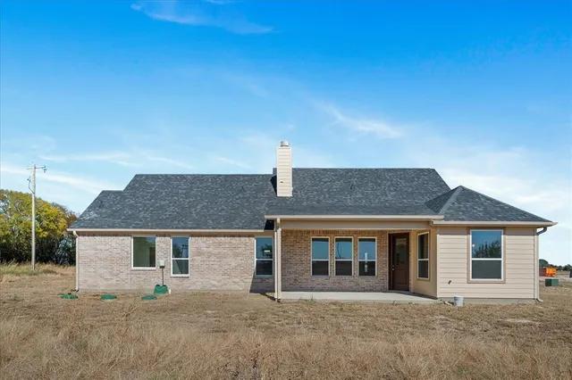front view of a house with a fence