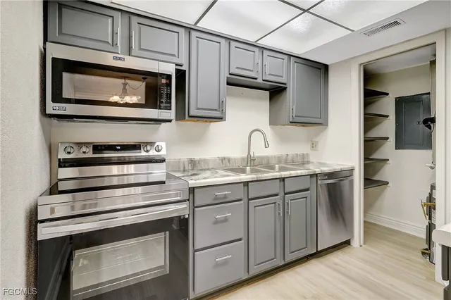 a kitchen with a refrigerator and countertop