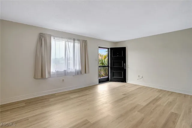 a kitchen with stainless steel appliances granite countertop a stove microwave and sink
